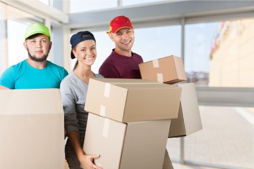 Student removals team handling boxes in Shoreditch near local flats